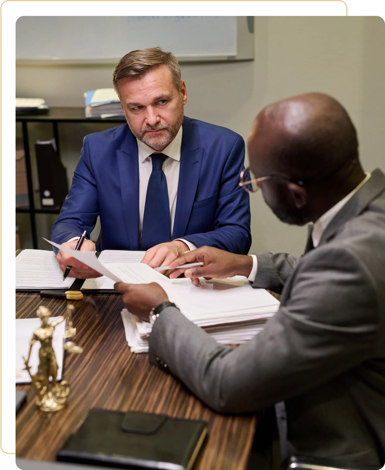 Two businessmen in a serious conversation